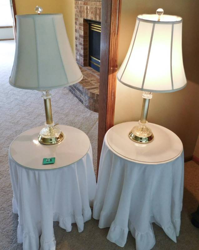 pair of decorative tables and lamps