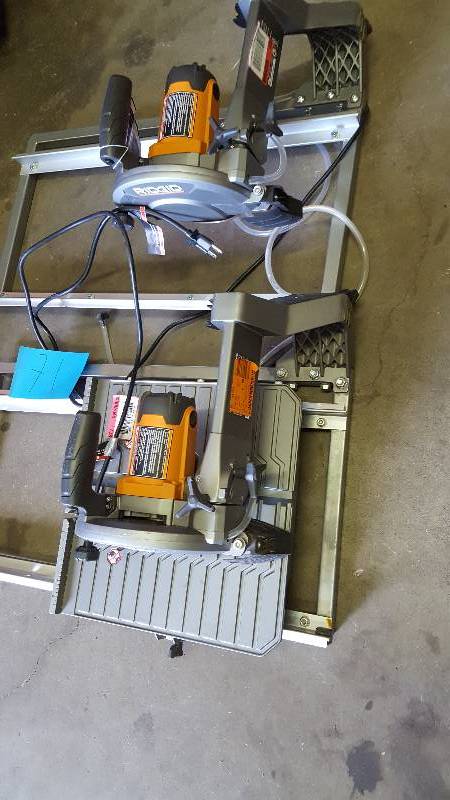 lot 71 image: Lot of 2 7 in Ridgid Tile saws for Parts- both tile saws turn on but are missing pieces