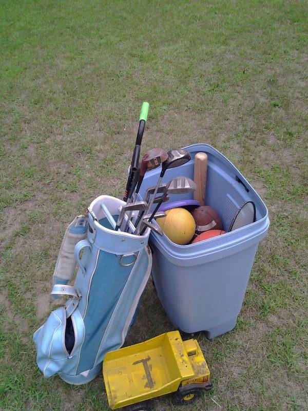 lot 64 image: Bin Full Of Toys, Basket Balls, Golf Clubs, Pogo Stick, Tonka Truck, More