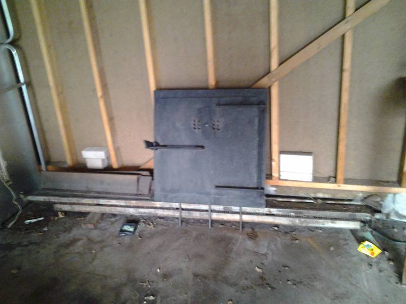 lot 68 image: New Wood Stove Door 29x29, Cast Iron Base Board Heaters, 6 Pieces Heavy Duty Angle Iron