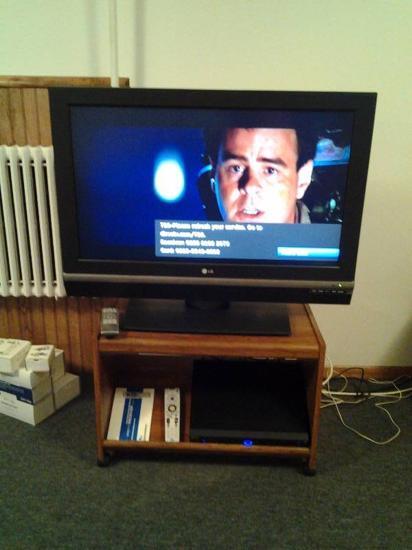 lot 146 image: LG 37 LC 2D TV With Rolling Stand 28x16x19, Direct TV Console & Remotes