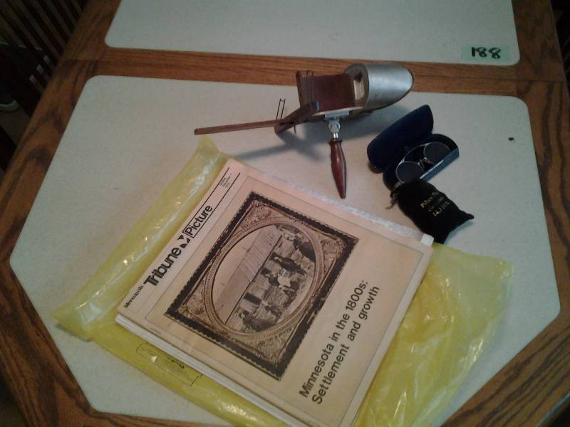 lot 213 image: Vintage Stereoscope, Old Spectacles, Newspapers, Pikes Peak Souvenir