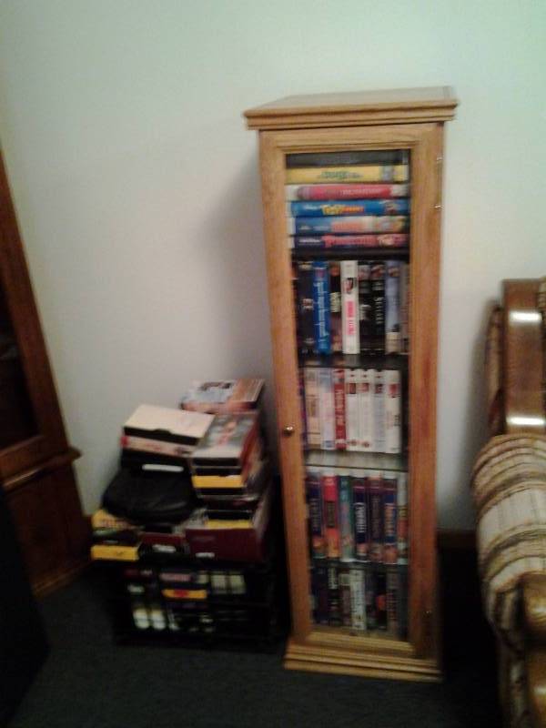 lot 240 image: Oak Swivel Media Cabinet With Contents (VHS)