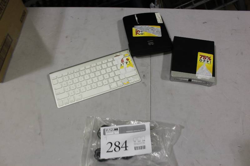 lot 284 image: Lot of (4) Electronics Including 1) Linksys E1200 Router AND 1) Wireless Keyboard AND 1) Dolby Analog Pass Through AND 1) RCA