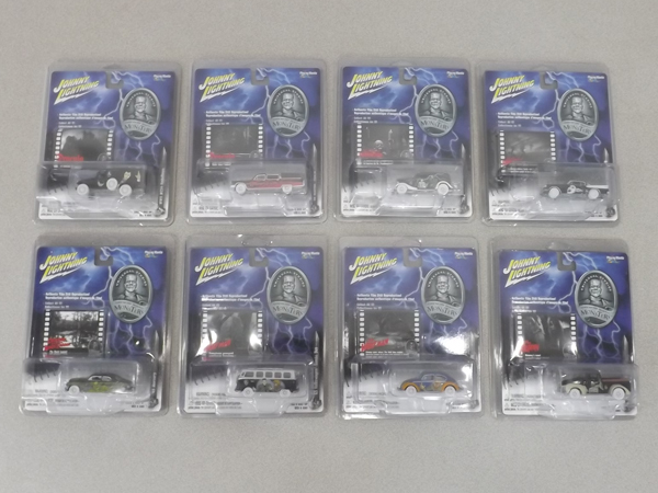 lot 26 image: 8 Johnny Lightning Monsters White Lightning in Protectors