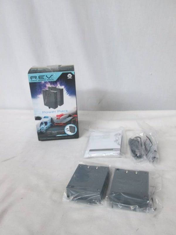 lot 60 image: Wow Wee REV Charging Kit for 2 Cars