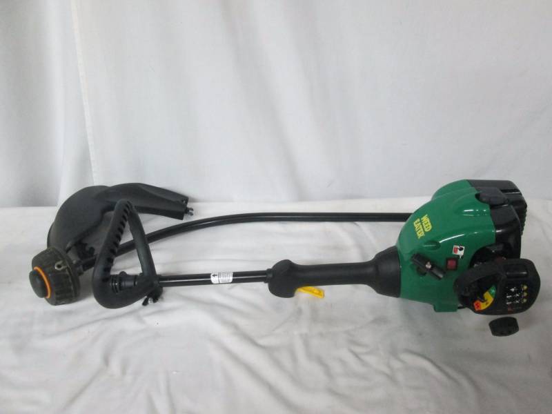 lot 21 image: Weed Eater 16 Curved Shaft 2-Cycle Gas-Powered Grass Trimmer