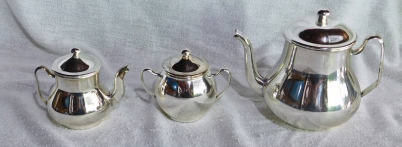 lot 34 image: Unmarked silver-plate tea pot creamer and sugar