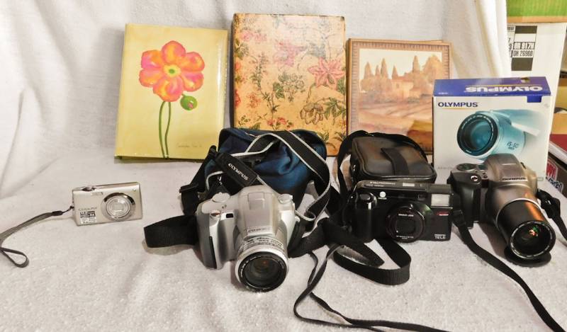lot 76 image: camera and photo album lot nikon does not charge 2 film cameras
