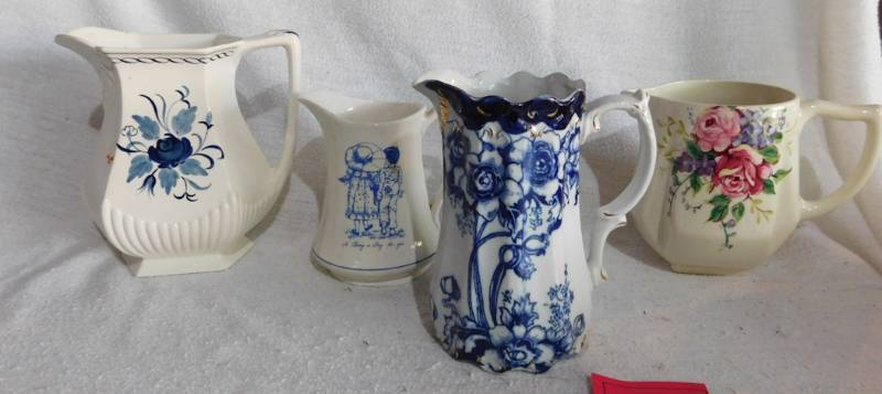 lot 166 image: 4 very nice vintage pitchers