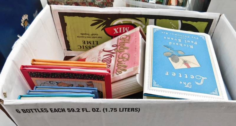 lot 127 image: lof of self help spiritual themed books
