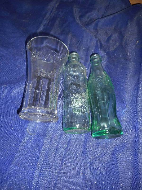lot 148 image: 2 COKE BOTTLES 1 OLD 1 HEAVY COLLECTOR COKE GLASS