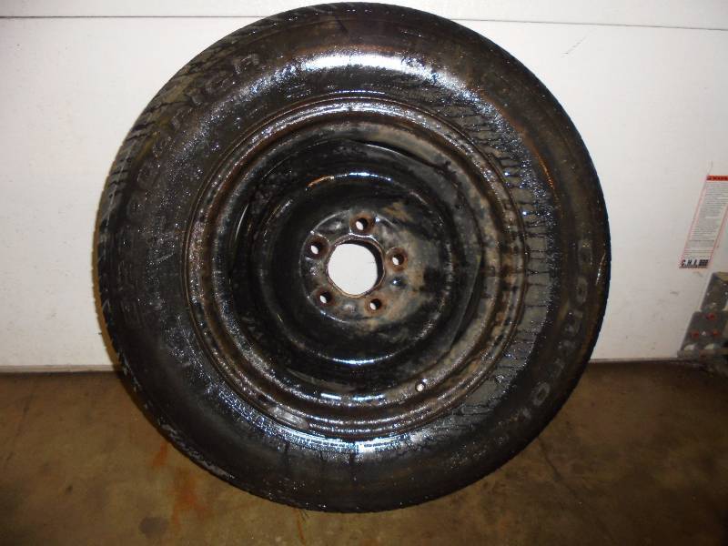 lot 72 image: Tire - BG Goodrich P20570 R15 Tire on Rim, great tread