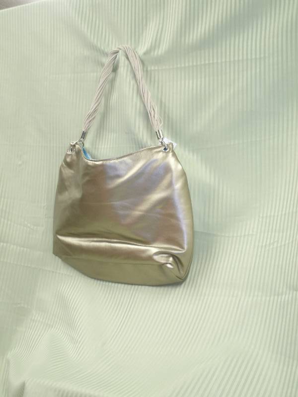 lot 30 image: Pureology Gold Purse
