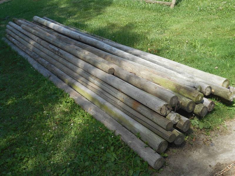 lot 200 image: Approx (24) Tapered 16ft Wooden Pos...
