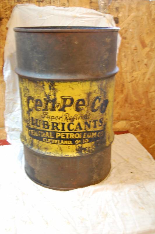Metal Barrel with oil advertising on it