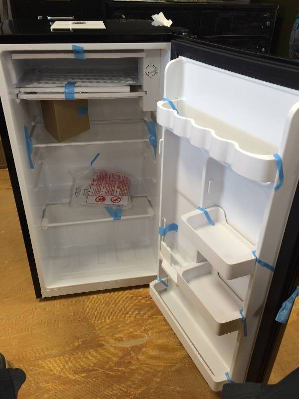 lot 56 image: Haier 3.3 cu ft Refrigerator, Black  new