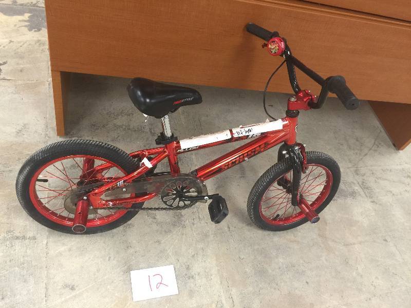 lot 12 image: 16 Kent Schism Boys Bike, Red in good conditions