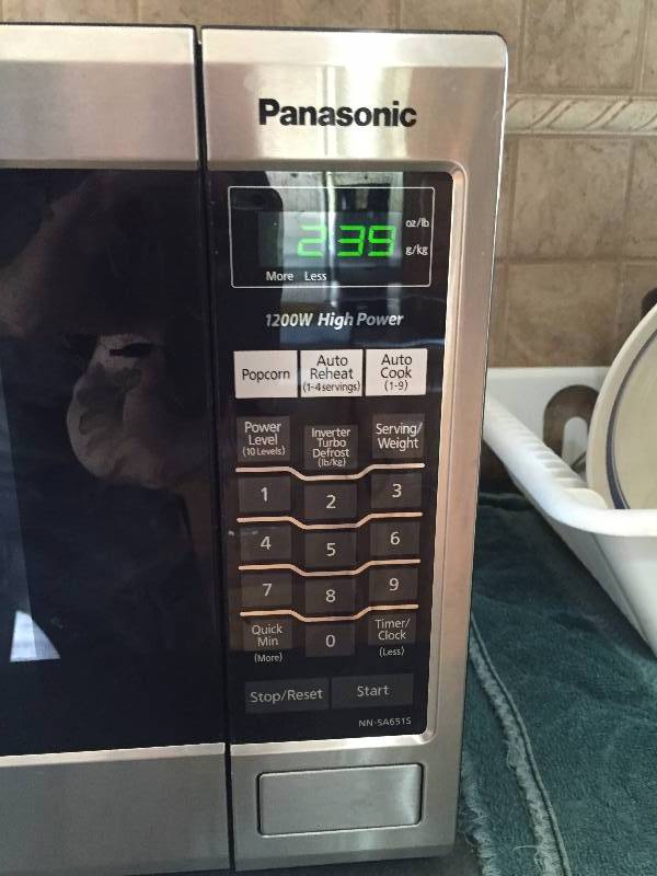 lot 12 image: Excellent 1200 Watt Stainless Steel Panasonic Microwave 20x12x13.5 - Works Great
