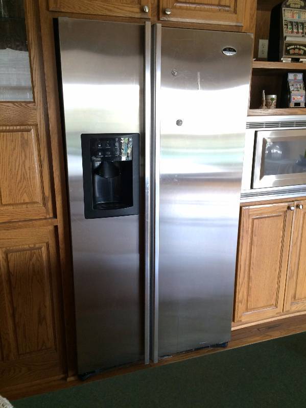 lot 24 image: WOW GE Profile Arctica CustomStyle 22.6 Cu. Ft. Stainless Side-By-Side Refrigerator Freezer Model Number PSI23SGMBKBS Download Manual httpproducts.geappliances.comappliancegea-specsPSI23SGMBS