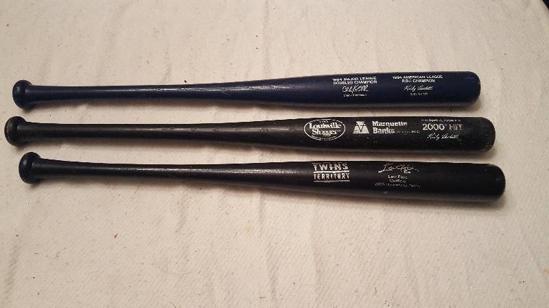 lot 44 image: 3 Twins Pro louisville sluggers, book, picture
