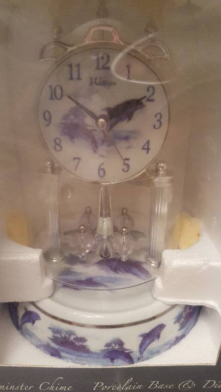 lot 58 image: Waltham Anniversary Clock. Dolphins