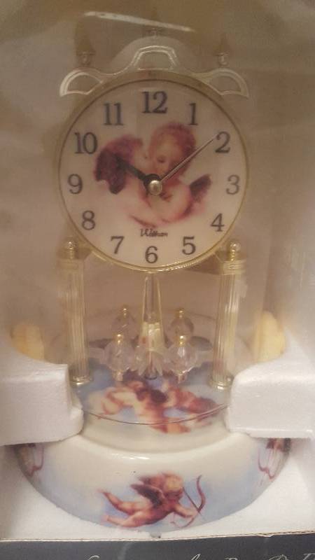 lot 60 image: Waltham Anniversary Clock. Cherubs