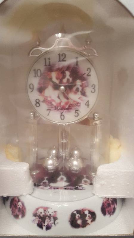 lot 62 image: Waltham Anniversary Clock. Puppies