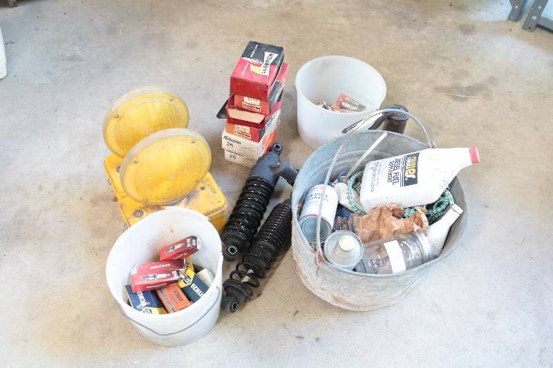 lot 99 image: New spark plugs , Harley shocks, signal lights and dodge sign