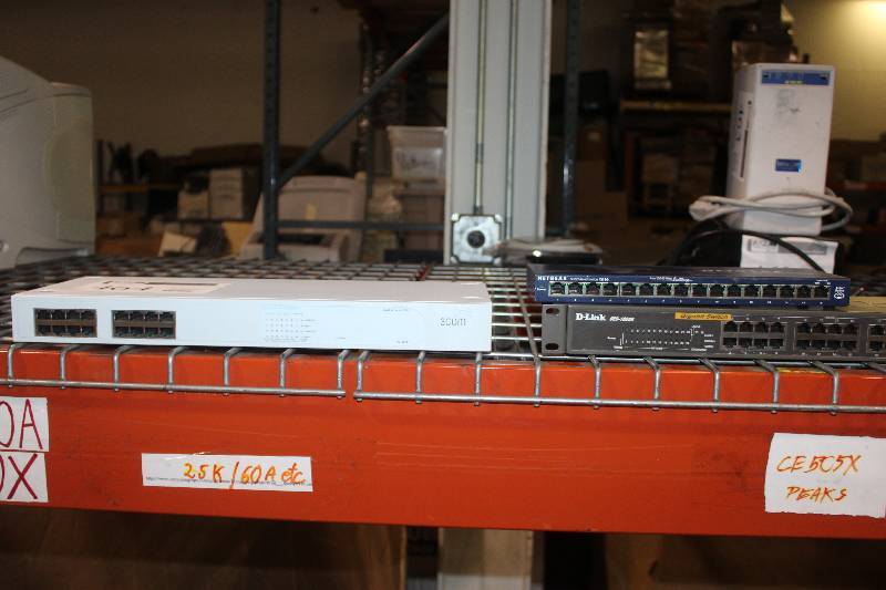 lot 464 image: Lot of (3) Electronics Including 1) 3Com Baseline Switch 2816 AND 1) Netgear Fast Ethernet Switch FS116 AND 1) D-Link DES-1026G Gigabit Switch
