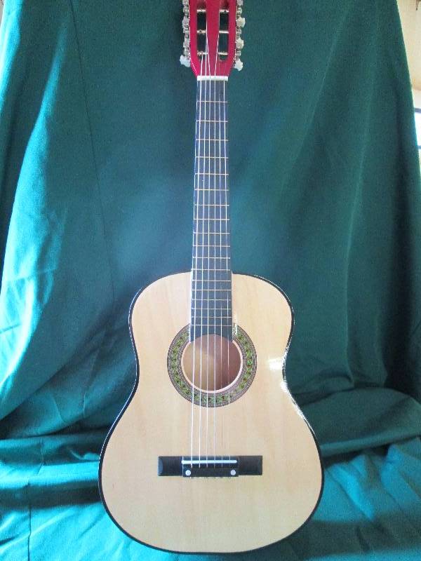 childrens guitar red in color...