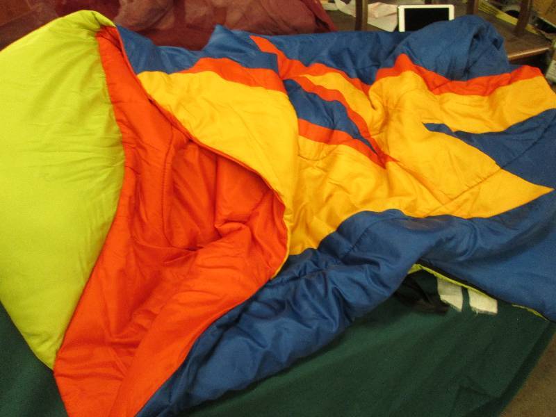 Bright colored sleeping bag with bu...