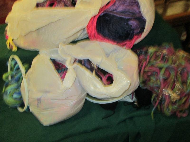 Covered tote filled with yarn, trim...