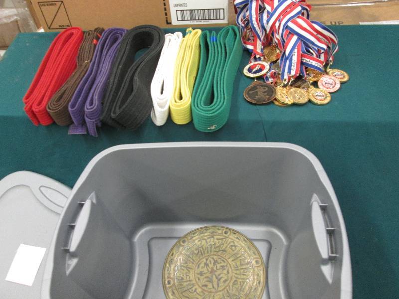 Karate Belts and medals in covered ...