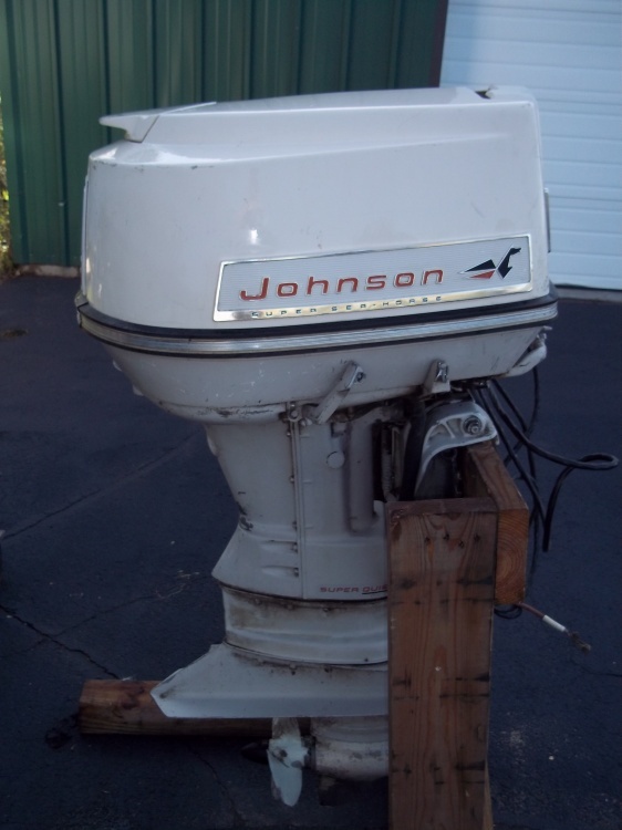lot 1 image: 1965  60 HP Johnston Outboard with Heavy duty stand