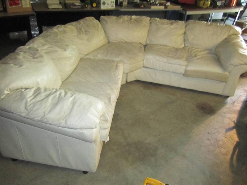 lot 18 image: White leather couch, each side is 7...