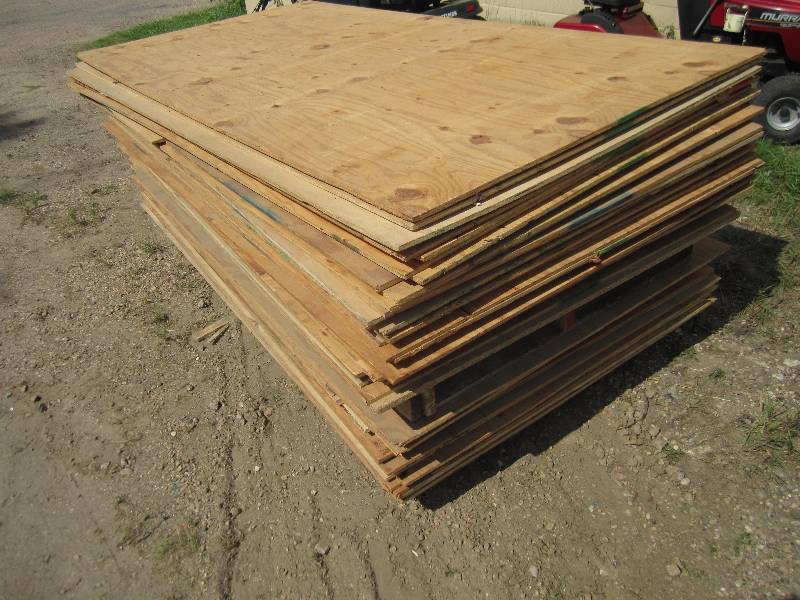 lot 104 image: Approx. 55 sheets of plywood, most ...