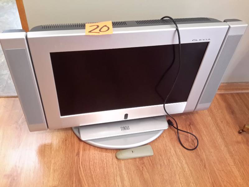 Syntax, 27 in TV with side speakers.  Turn table.. Owner says this works fine.