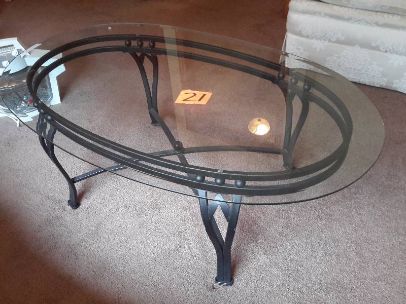 Metal Frame with heavy Glass top coffee table..