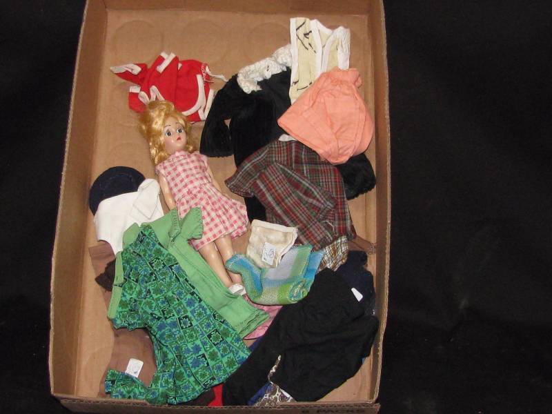 lot 7 image: Doll with Misc. Clothing.