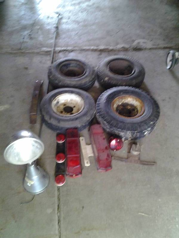 lot 58 image: Lot Of TrailerMarine Related Tires, Lights, Leaf Spring, Vintage Owens Marine Spot Light