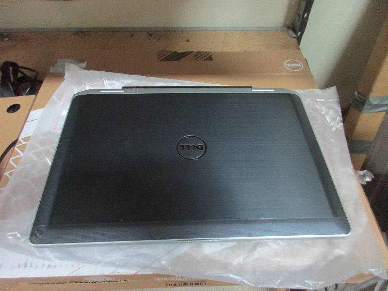 4. Dell Latitude E6430 series laptop computer with recharger and box.