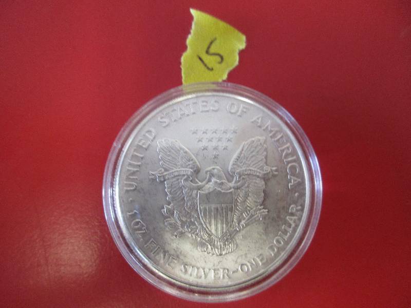 15. 2005 American Silver Eagle 1oz bullion coin in a protective capsule
