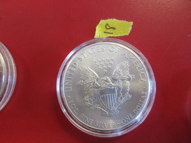 18. 2014 American Silver Eagle 1oz bullion coin in a protective capsule