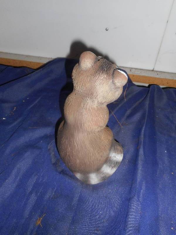 raccoon yard ornament
