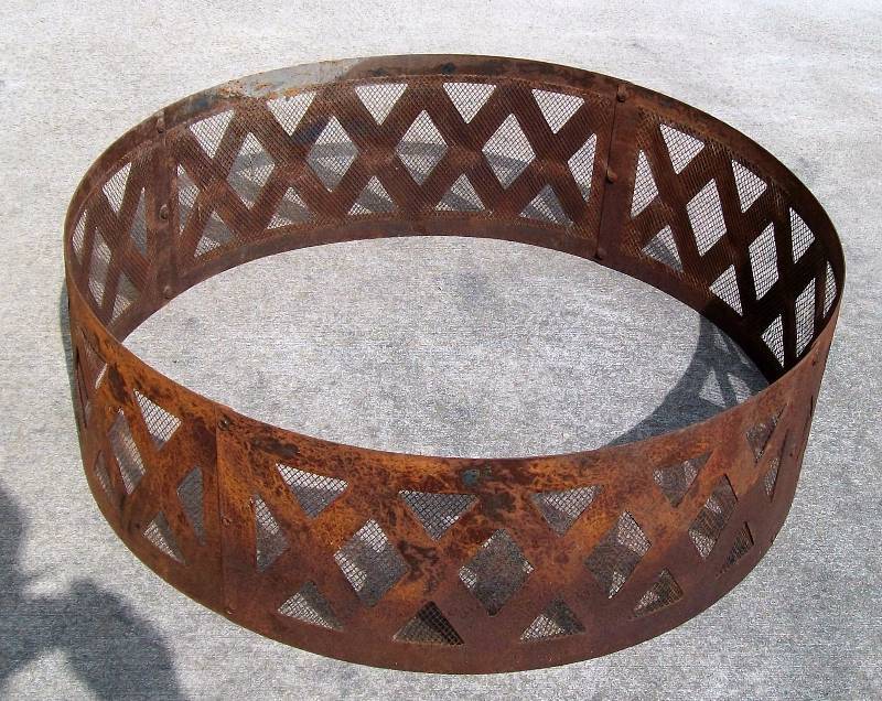 lot 18 image: Steel Fire Ring with Diamond Pattern in Mesh. 3 feet in diameter.