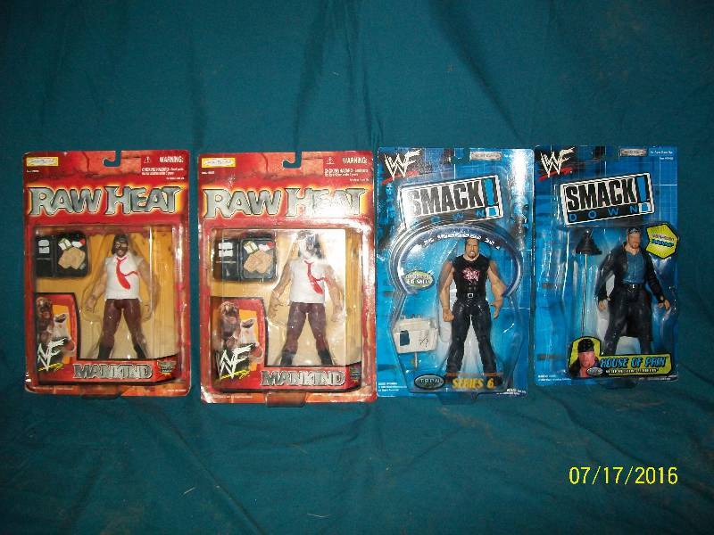 lot 22 image: 4 Vintage WWF Wrestling Action Figures. 2 Raw HeatMankind. 2 Smack down 1-Undertaker & 1-Big Show.