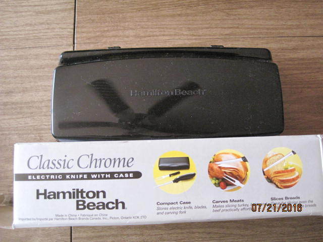 lot 28 image: Hamilton Beach Electric Carving Knife with Case (model #74275).