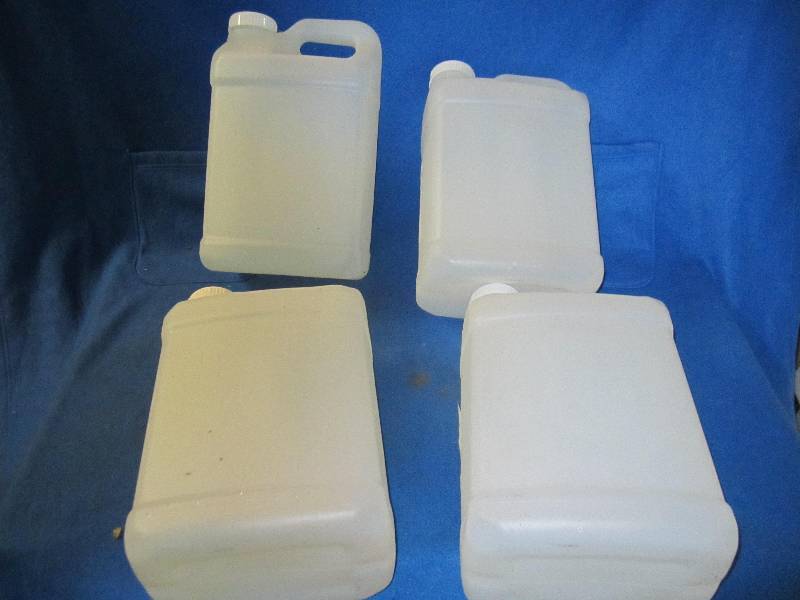 lot 23 image: Four 2.5 gallon plastic containers,...