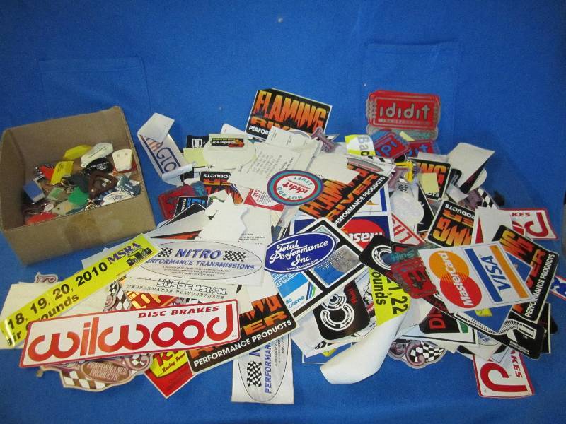 lot 52 image: Lot of key chains, decals and stick...